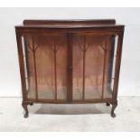 20th century bow-front display cabinet, astragal glazed doors enclosing shelves, cabriole