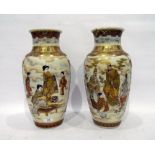 Pair of late 19th century Japanese Satsuma baluster vases, painted and richly gilt with figures
