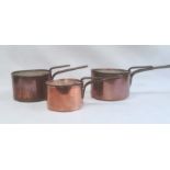 A set three copper and iron handled pans with lids Condition Report Two are 20.5cm in diameter,
