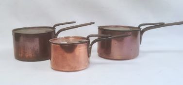 A set three copper and iron handled pans with lids Condition Report Two are 20.5cm in diameter,