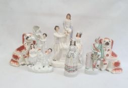 Staffordshire pottery flatback group of a man and woman on either side of a lady on a pedestal,