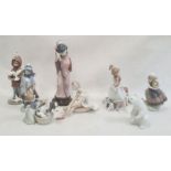 Quantity of Lladro figures to include Geisha girl, polar bear, girl grooming dog, boy with