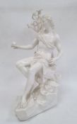 Nymphenburg porcelain blanc de chine classical figure of a male holding an apple, sitting on a rock,