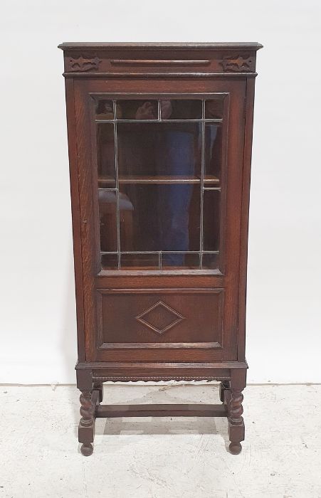 Narrow oak 20th century cabinet, the rectangular top with moulded edge above glazed door enclosing