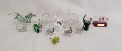 Three Murano glass models of elephants with iridescent bodies, 7cm high, two glass models of cats