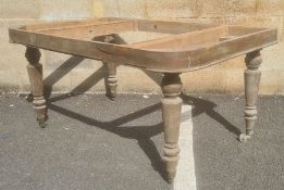 In the manner of Gillows of Lancaster table frame with four Gillows type turned legs, brass caps and