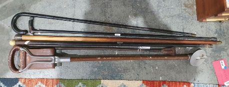 Silver-topped walking cane, two Slazenger and one Dunlop racquets and other walking canes together