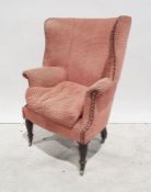 19th century barrel back armchair in pink ground upholstery, turned and reeded front legs to brass