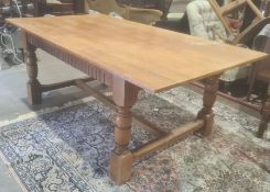 20th century oak table, rectangular top on turned and block supports, stretchered base, 184cm long