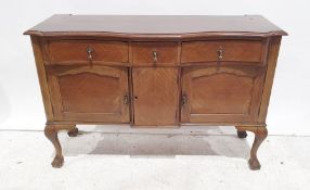 20th century sideboard, serpentine front with three drawers above three cupboard doors, cabriole