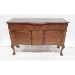 20th century sideboard, serpentine front with three drawers above three cupboard doors, cabriole