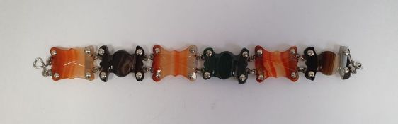 Antique silver and agate bracelet, the six shaped agate panels striped in shades of brown, orange