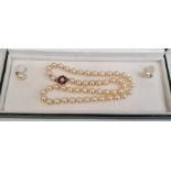 Cultured pearl necklace, single strand, 44cm and the 9ct gold garnet and seed pearl cluster set