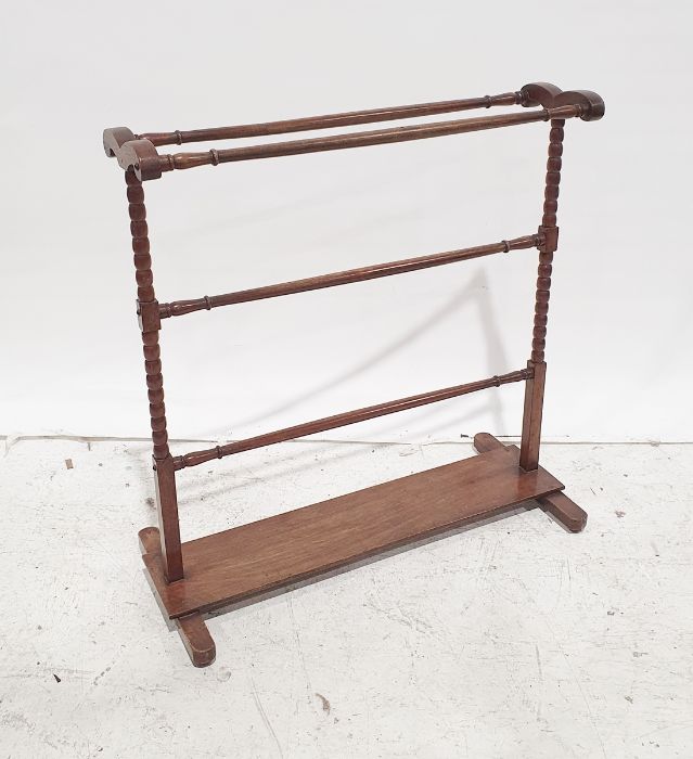 Early 20th century mahogany towel rack, bobbin end supports, plank stretcher