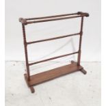 Early 20th century mahogany towel rack, bobbin end supports, plank stretcher