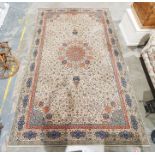 Cream ground modern rug with allover foliate decoration, stepped border, 457cm x 275cm