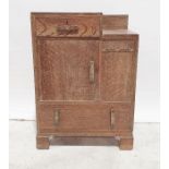 Early 20th century Art Deco style oak bedroom unit with single drawer above cupboard door above long