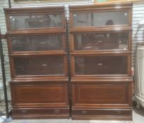 Pair of four-section Globe Wernicke mahogany and satinwood banded sectional bookcases with ivorine