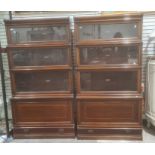 Pair of four-section Globe Wernicke mahogany and satinwood banded sectional bookcases with ivorine