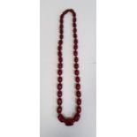Red amber bead necklace, graduated and nine loose beads, gross weight approx. 110gCondition Report