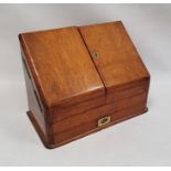 Late 19th/ early 20th century oak desk tidy the twin doors opening to reveal sectioned interior,