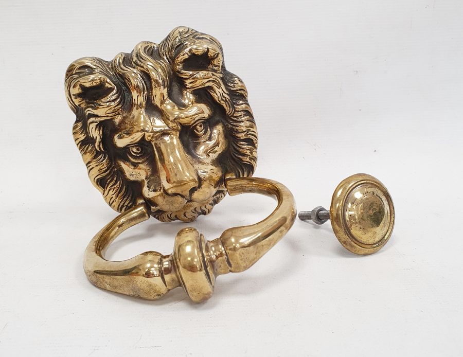 Brass door knocker modelled as a lion's mask with ring handle and knocking plate