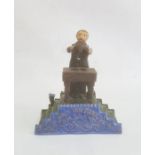 Circa 1900 cast iron money bank, painted 'Magician Bank', with magician standing at table with