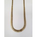 9k gold necklace, pierced with graduated filigree edges, 14.8g approx.