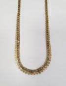 9k gold necklace, pierced with graduated filigree edges, 14.8g approx.