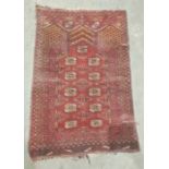 Red ground Eastern rug with elephant's foot gul decoration, 108cm x 75cm