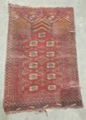 Red ground Eastern rug with elephant's foot gul decoration, 108cm x 75cm