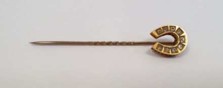 Victorian gold-coloured stickpin with horseshoe finial, set with nine diamonds, marked 15