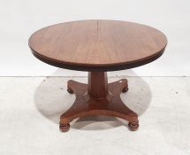 19th century mahogany circular dining table on faceted column to quatrefoil base, turned feet, 140cm