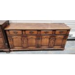 20th century oak low dresser, rectangular top, four short drawers above cupboards, stile supports,