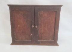 Oak jewel cabinet with two doors enclosing shelves and contents of assorted nuts, bolts, drill bits,