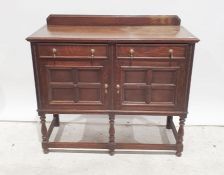 20th century oak sideboard, rectangular top, moulded edge, two drawers, two cupboard doors, turned