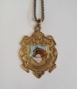 9ct gold medallion set pendant painted with shield of horse's head "Presented to T. Nelson Jnr by