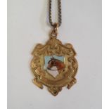 9ct gold medallion set pendant painted with shield of horse's head "Presented to T. Nelson Jnr by