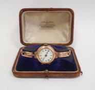 A lady's 9ct gold wristwatch, Roman numerals to the white enamel dial, in a Penlington & Batty
