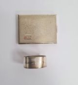 Kigu silver compact, rectangular and engine-turned, initialled 'SKD' and a silver napkin ring,