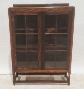 Early 20th century oak bookcase, the astragal glazed doors enclosing shelves, turned and block