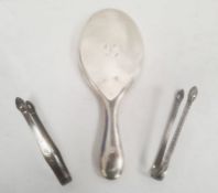 Two Georgian silver sugar nips, engraved decoration and an early 20th century silver-backed dressing