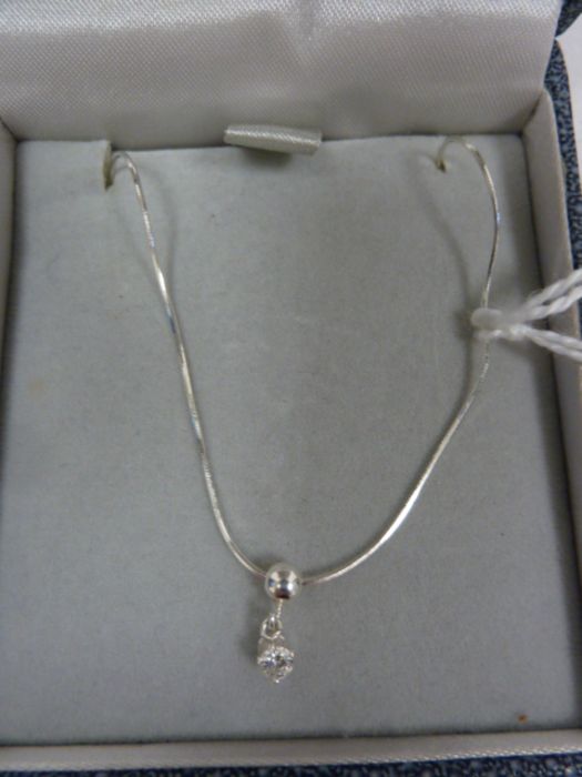 Solitaire diamond drop pendant, claw-set in silver mount, on fine chain, the stone approx 0.10ct - Image 2 of 4