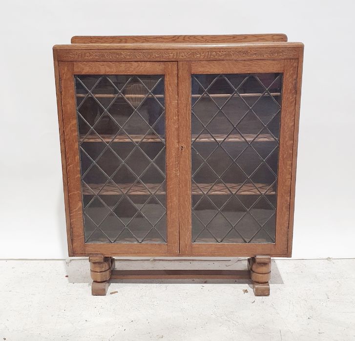 20th century oak bookcase with leaded glazed doors enclosing shelves, 105cm x 120cm