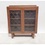 20th century oak bookcase with leaded glazed doors enclosing shelves, 105cm x 120cm