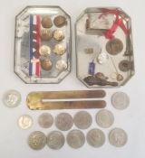 Vintage tin containing various military buttons and assorted coins in clear plastic bag (2)