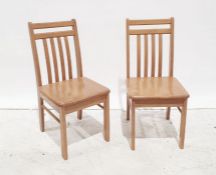 Four modern beech slat-back chairs