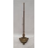 Brass standard lamp with shaped hexagonal base and paw feet