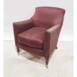 Modern plum ground patterned armchair, turned supports, brass caps and castors