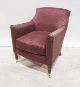 Modern plum ground patterned armchair, turned supports, brass caps and castors